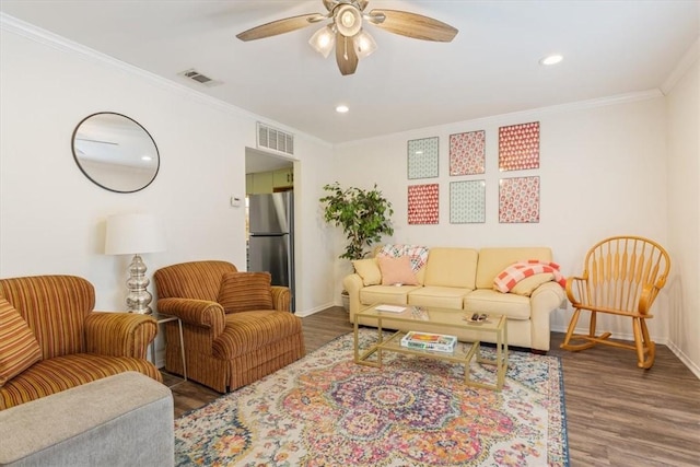 living room featuring ornamental molding, dark hardwood / wood-style floors, and ceiling fan