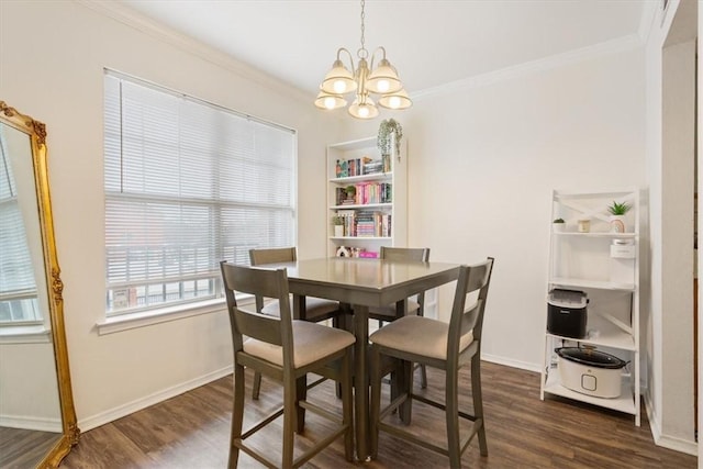 dining space with ornamental molding, dark hardwood / wood-style floors, and an inviting chandelier