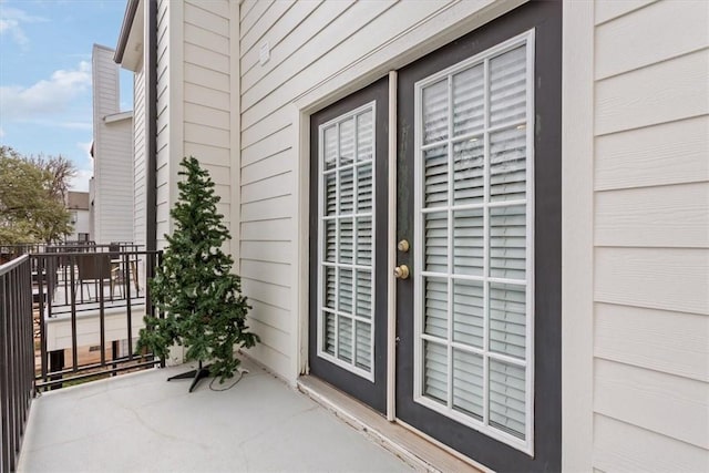 entrance to property with a balcony