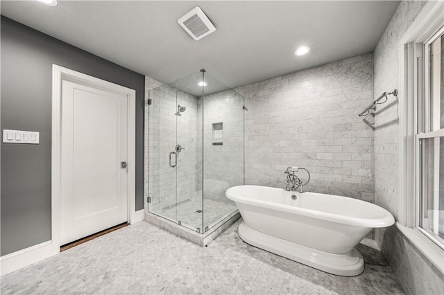 bathroom featuring plus walk in shower