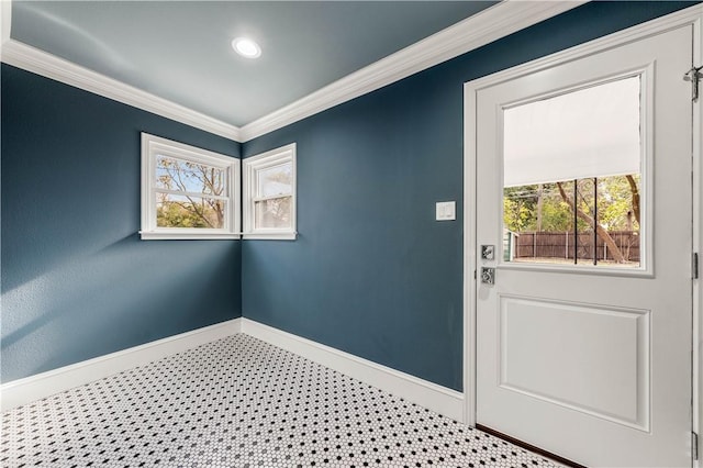 doorway to outside featuring crown molding and plenty of natural light