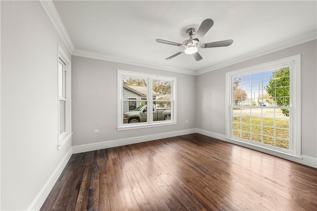 empty room featuring dark hardwood / wood-style flooring, ceiling fan, and ornamental molding