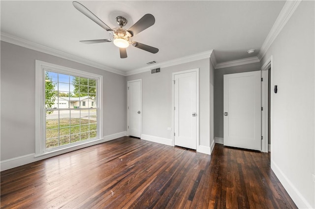 unfurnished bedroom featuring ceiling fan, crown molding, and dark wood-type flooring