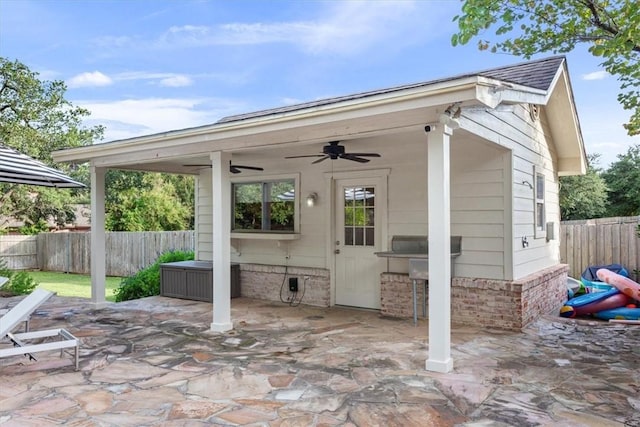 view of patio featuring ceiling fan