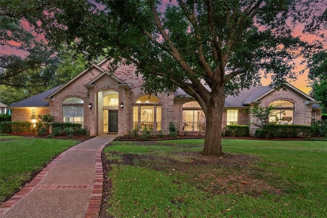 view of front of home featuring a lawn