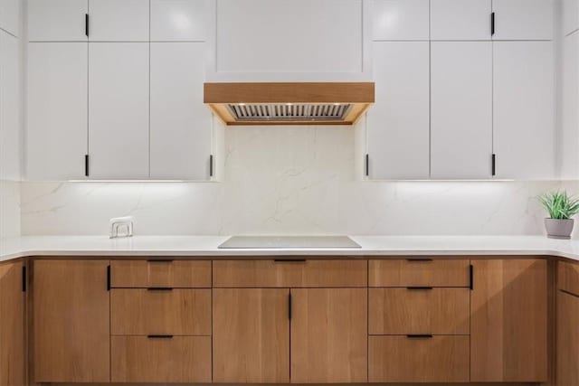 kitchen featuring white cabinetry and black electric stovetop