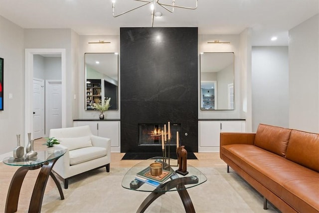 living room featuring a fireplace and an inviting chandelier