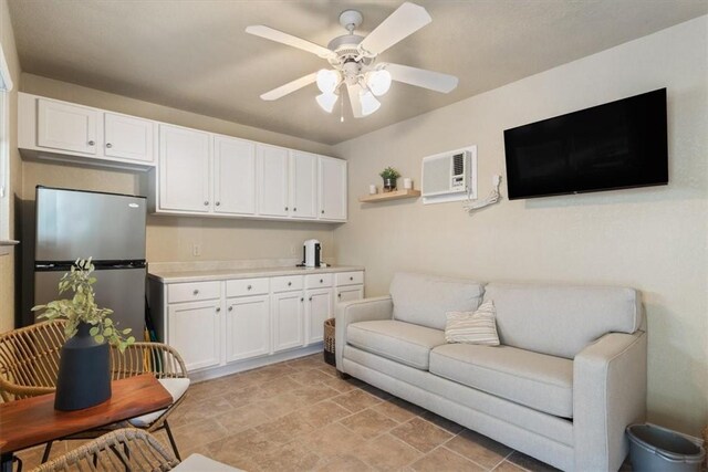 living room with ceiling fan