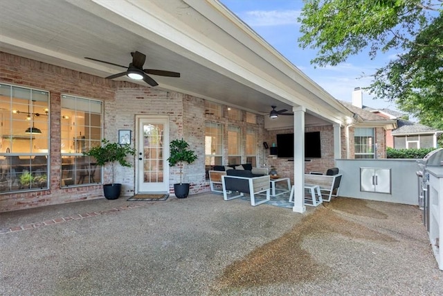 view of patio with an outdoor kitchen and ceiling fan