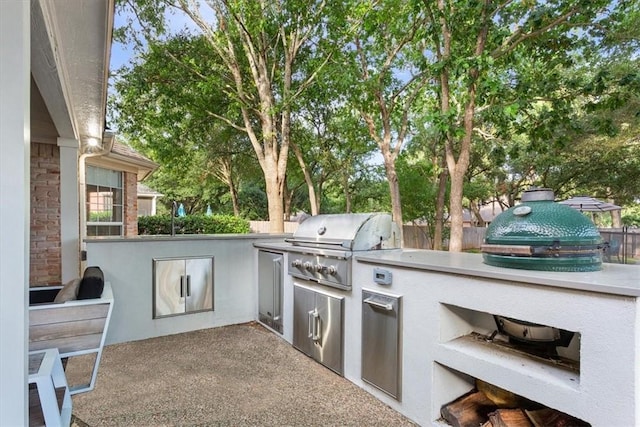 view of patio / terrace featuring area for grilling and a grill