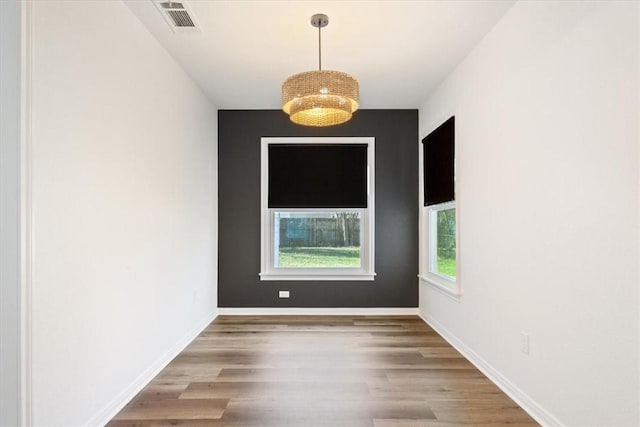 spare room featuring hardwood / wood-style flooring