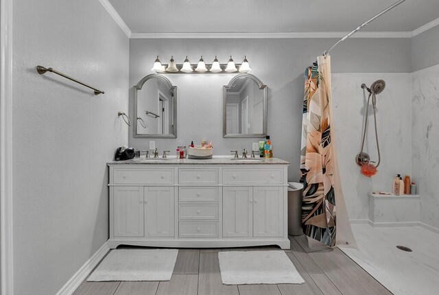 bathroom featuring a shower with shower curtain, wood-type flooring, vanity, and ornamental molding