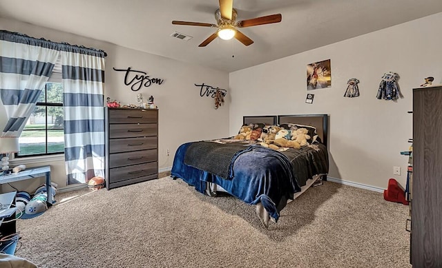 bedroom with ceiling fan and carpet floors