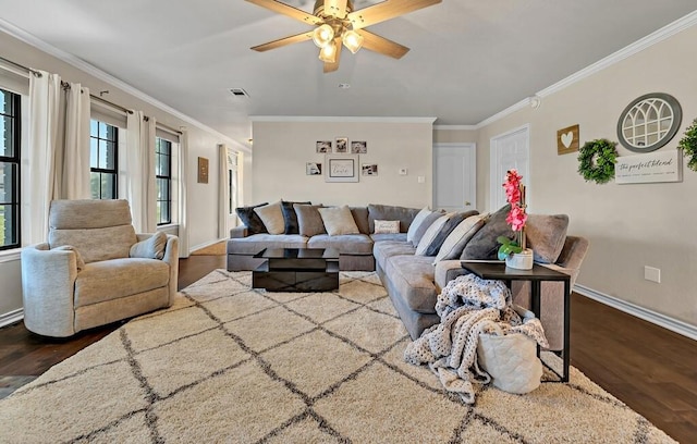 living room featuring crown molding, dark hardwood / wood-style flooring, and ceiling fan