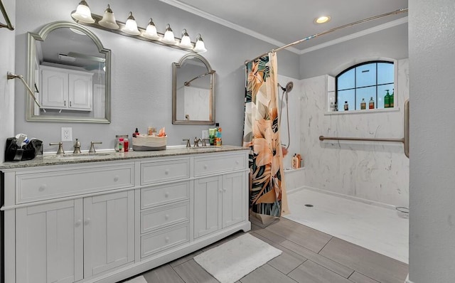 bathroom with vanity, curtained shower, and ornamental molding