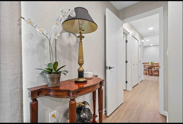 hallway featuring light wood-type flooring