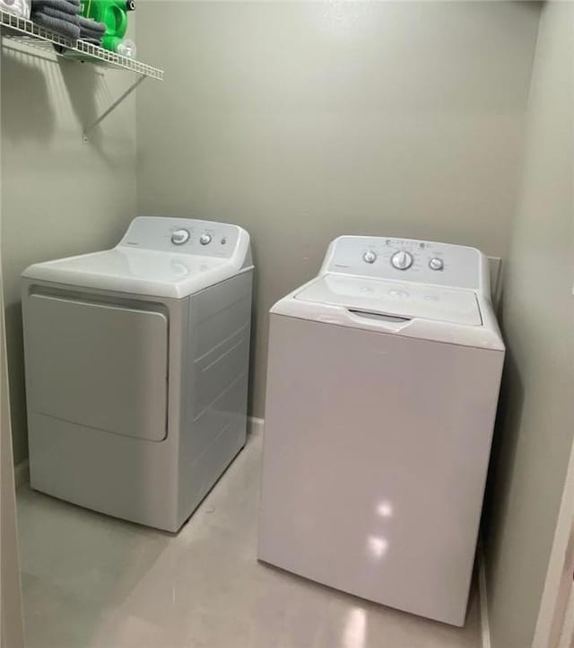 washroom with washer and dryer and laundry area