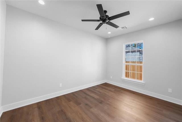 spare room featuring recessed lighting, visible vents, dark wood-type flooring, ceiling fan, and baseboards