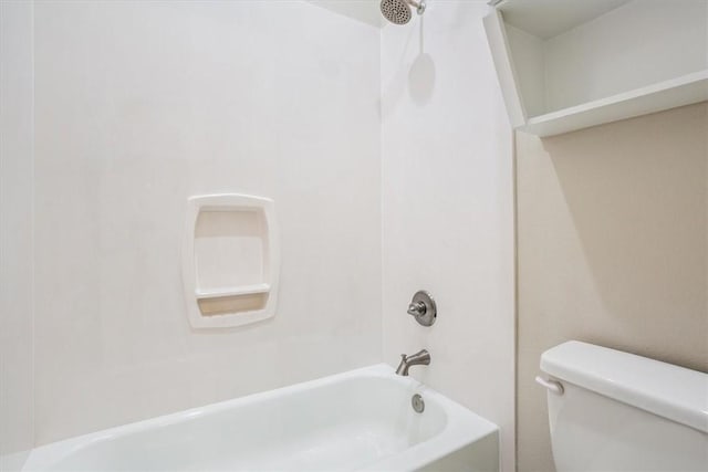 bathroom featuring toilet and tub / shower combination