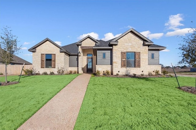 craftsman-style house featuring a front lawn