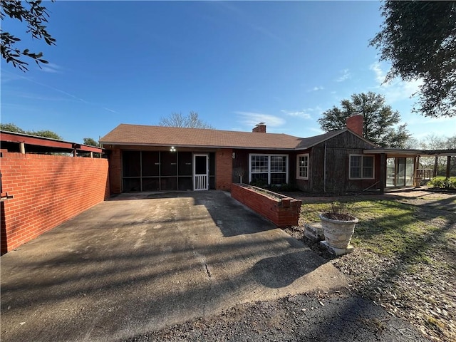 single story home with a sunroom