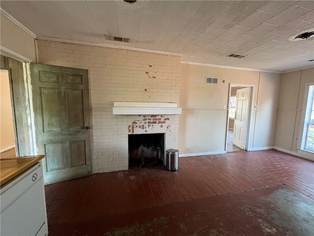 unfurnished living room featuring a fireplace, hardwood / wood-style floors, ornamental molding, and brick wall