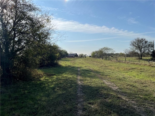 view of yard with a rural view