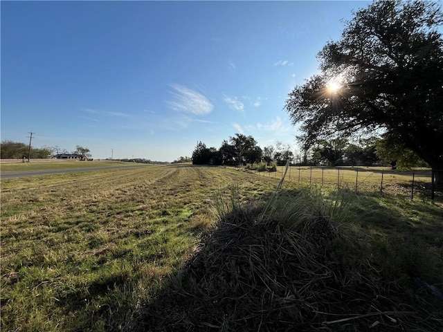 view of yard with a rural view