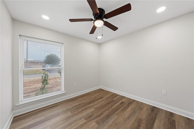 unfurnished room with wood-type flooring and ceiling fan