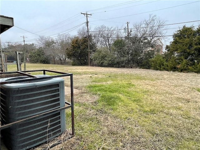 view of yard featuring central air condition unit