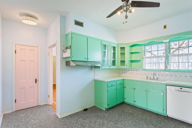 kitchen featuring light countertops, visible vents, white dishwasher, and a sink