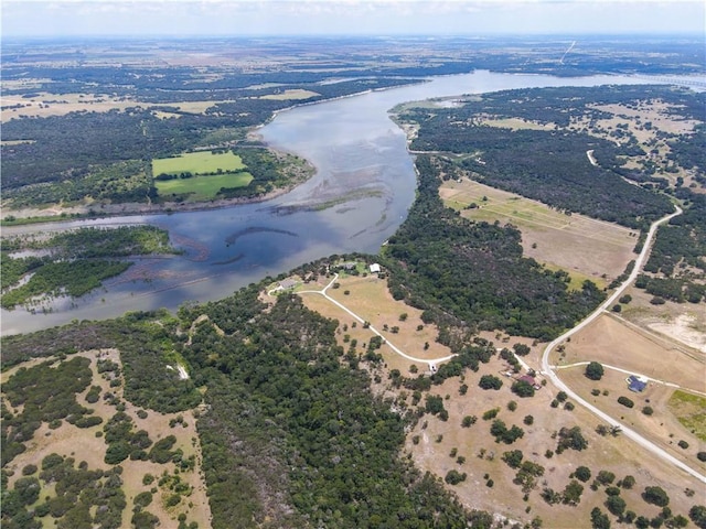 birds eye view of property with a rural view and a water view