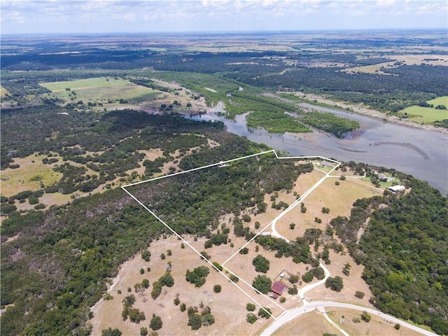 drone / aerial view featuring a rural view and a water view