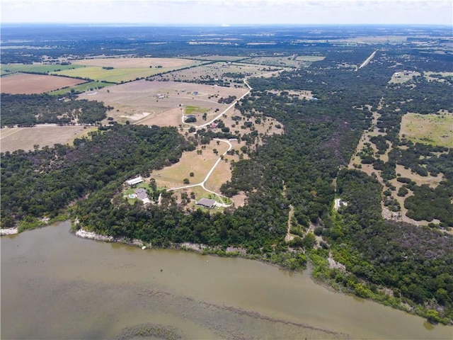 drone / aerial view with a rural view and a water view