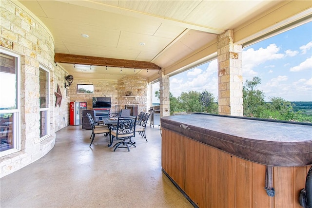 view of patio / terrace featuring a hot tub