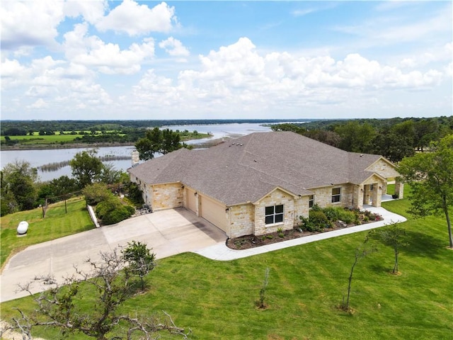 birds eye view of property with a water view