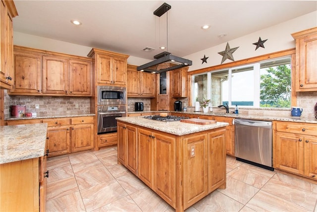 kitchen featuring stainless steel appliances, premium range hood, decorative light fixtures, decorative backsplash, and a kitchen island