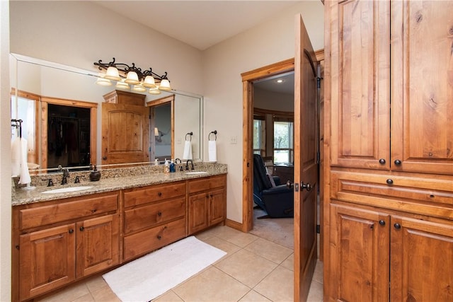 bathroom with tile patterned flooring and vanity