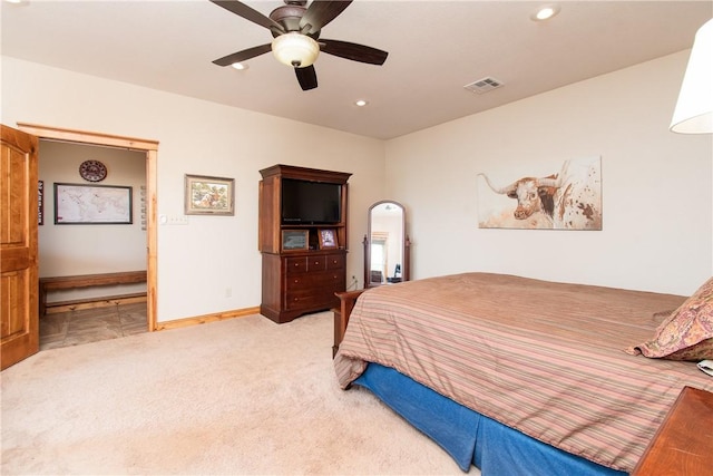 bedroom featuring light colored carpet and ceiling fan