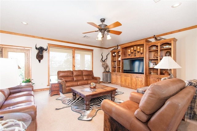 living room with ceiling fan and ornamental molding