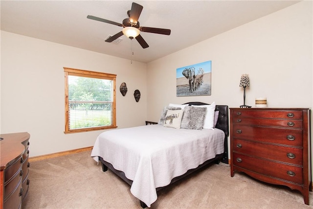 bedroom featuring light carpet and ceiling fan