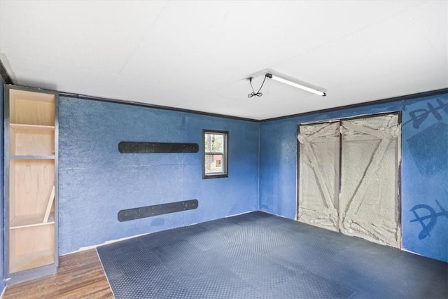 interior space featuring ceiling fan and dark wood-type flooring