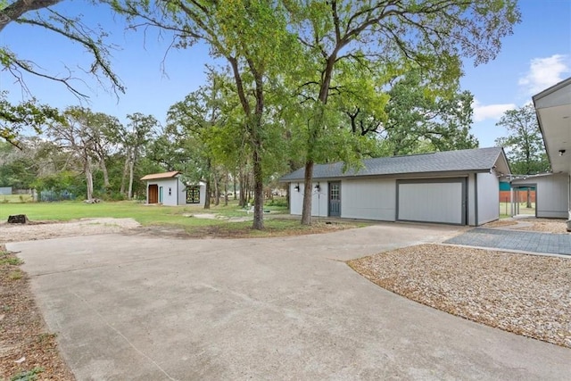 ranch-style home with a front yard and an outbuilding