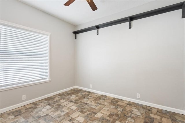 unfurnished room featuring ceiling fan