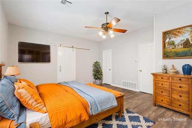 bedroom featuring ceiling fan and dark wood-type flooring