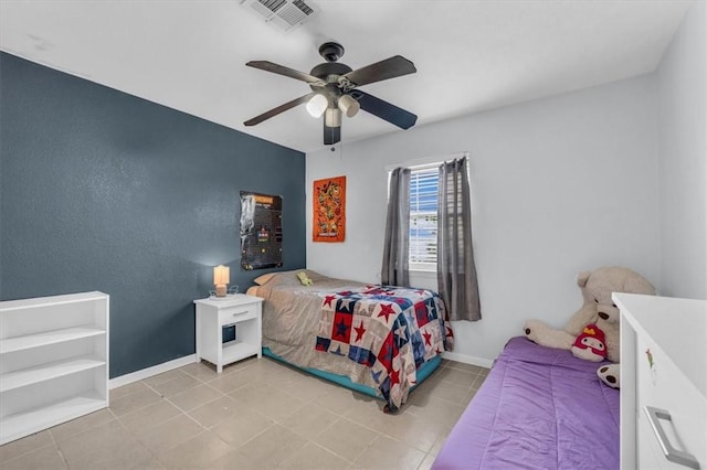 bedroom with light tile patterned floors and ceiling fan