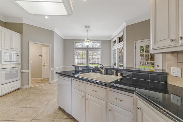 kitchen featuring white cabinets, white appliances, ceiling fan, and sink