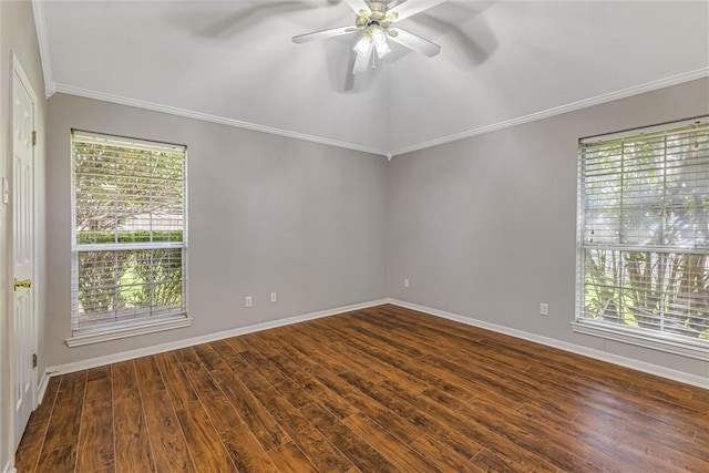 spare room with ornamental molding, dark hardwood / wood-style flooring, ceiling fan, and a healthy amount of sunlight