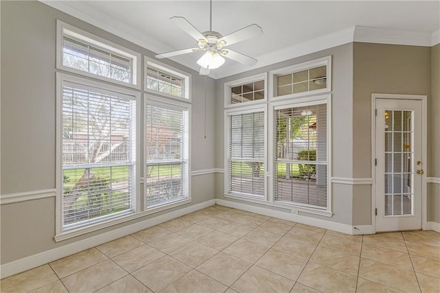 unfurnished sunroom featuring ceiling fan