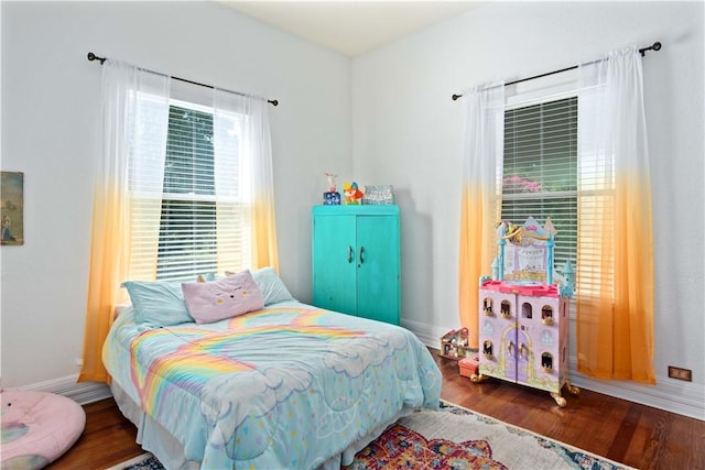 bedroom with hardwood / wood-style floors